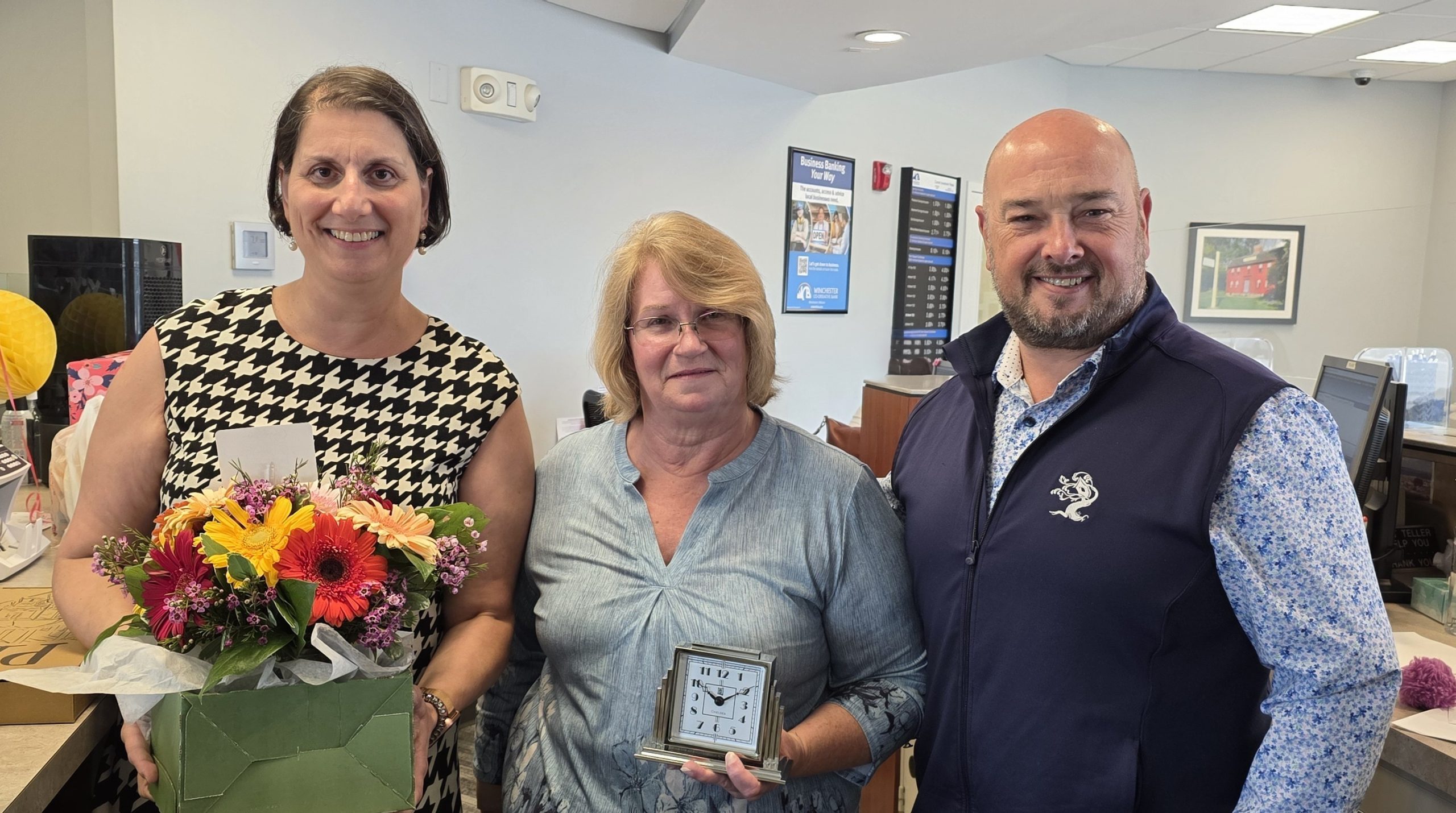 Linda, Roberta and Chris standing in Woburn branch