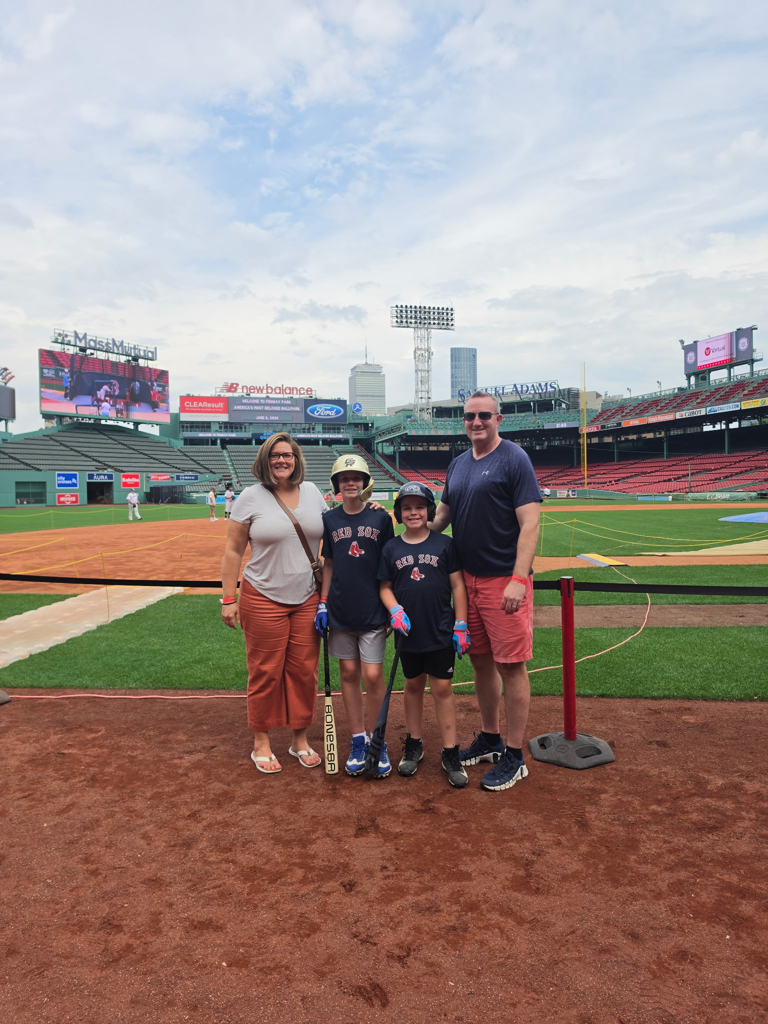 Scott and his family standing at the field
