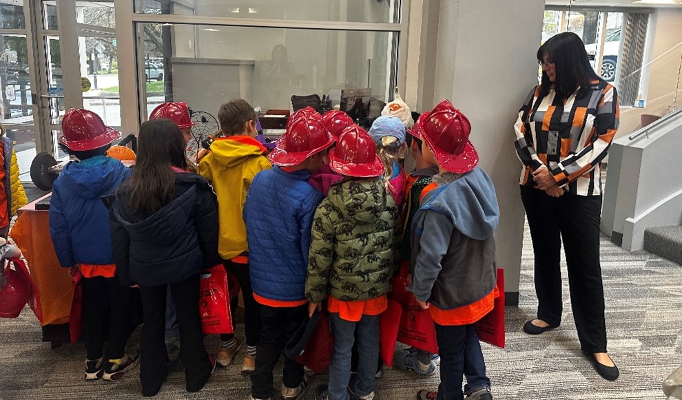 children with Karen looking at office