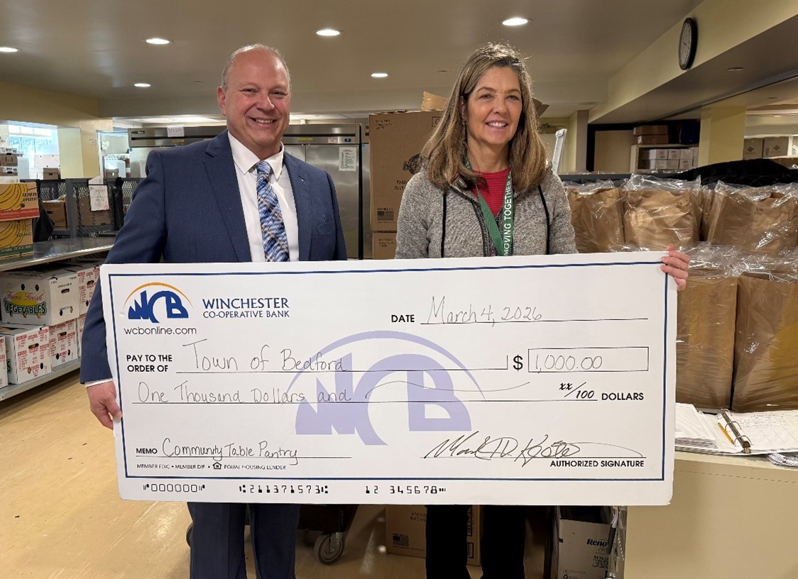 John with big check and woman on the right