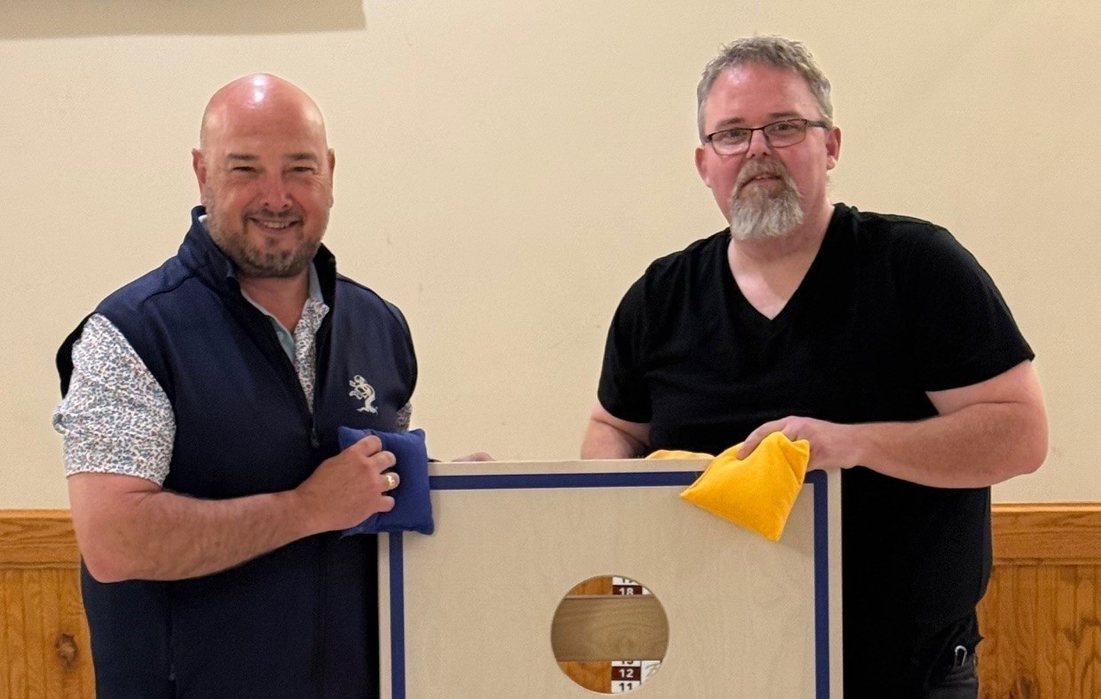 Chris and John with cornhole board