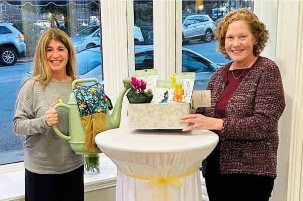 Julie Hammond giving Ronell Porrovecchio, the winner of the garden gift basket. 