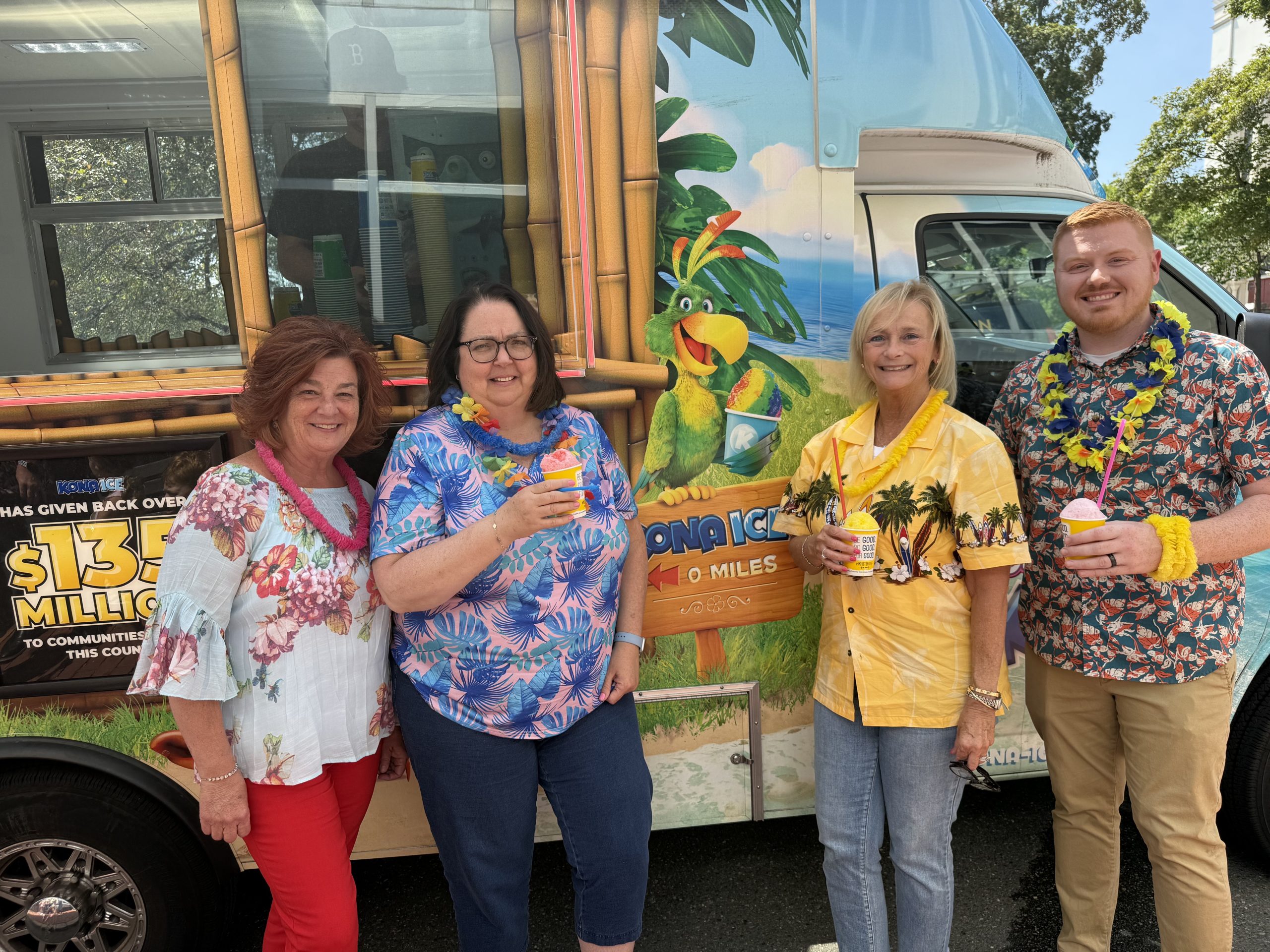 group with kona ice truck in background