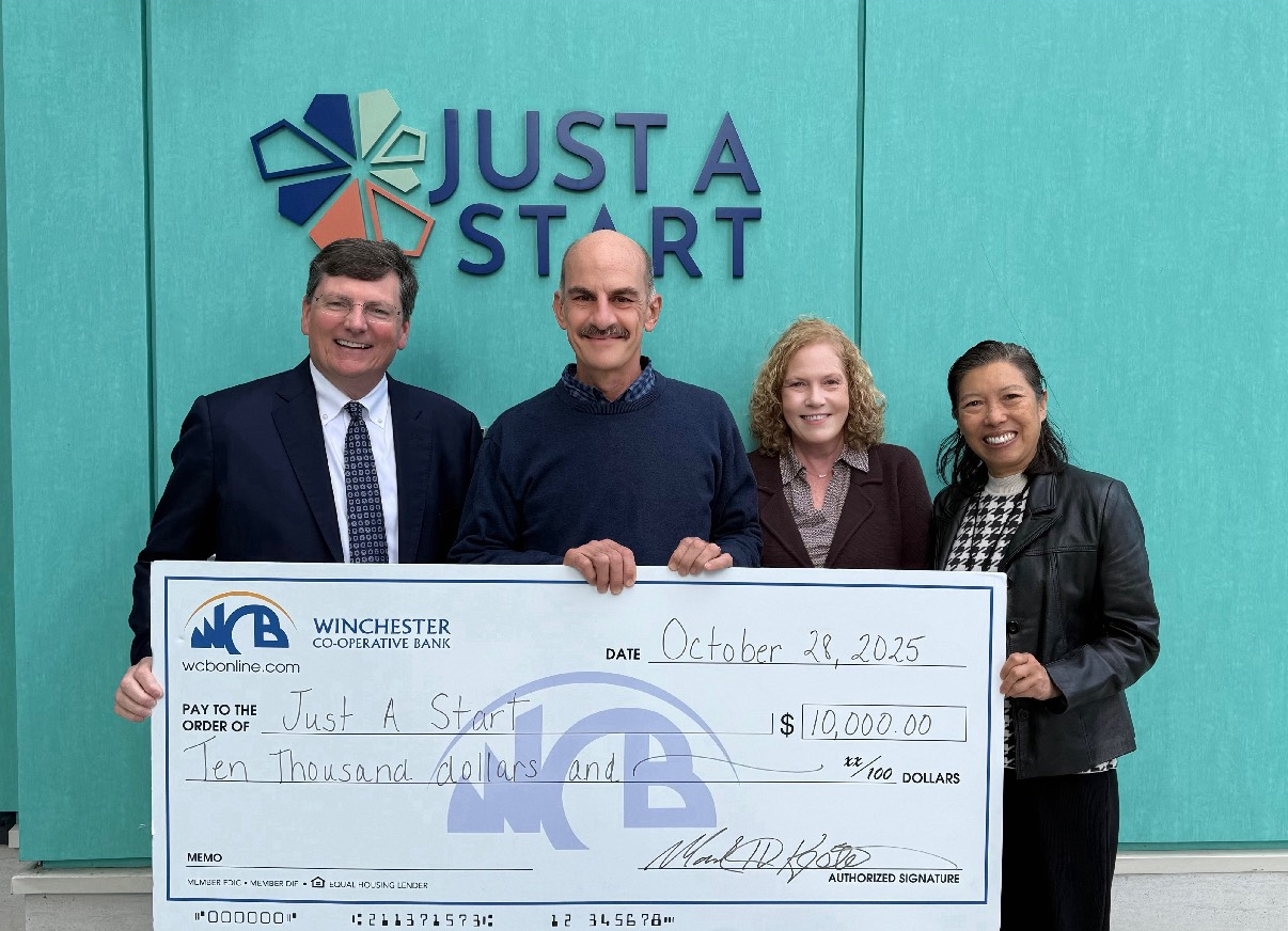 Steve and Julie with JAS executives and big donation check