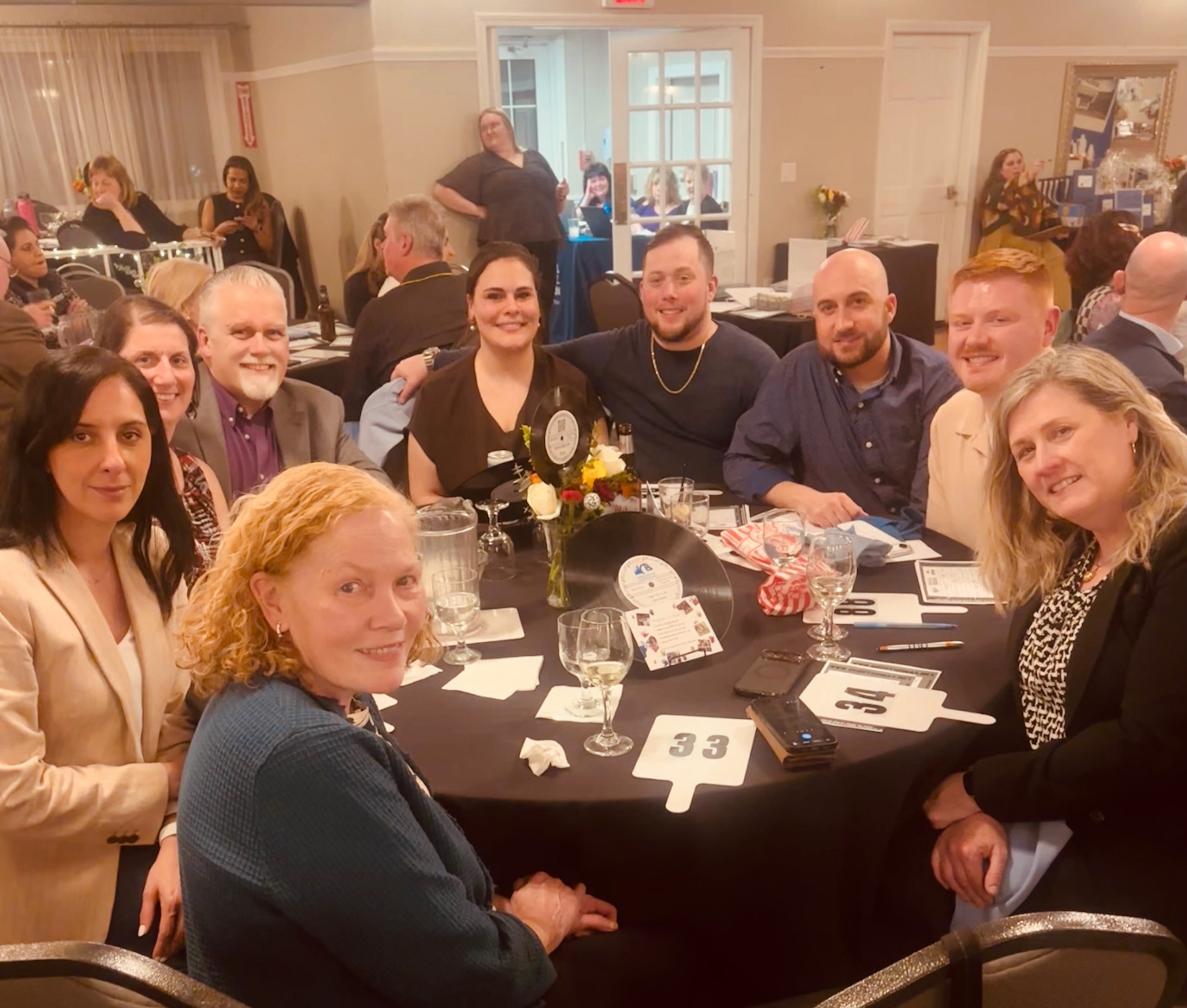 Group of people at round table.