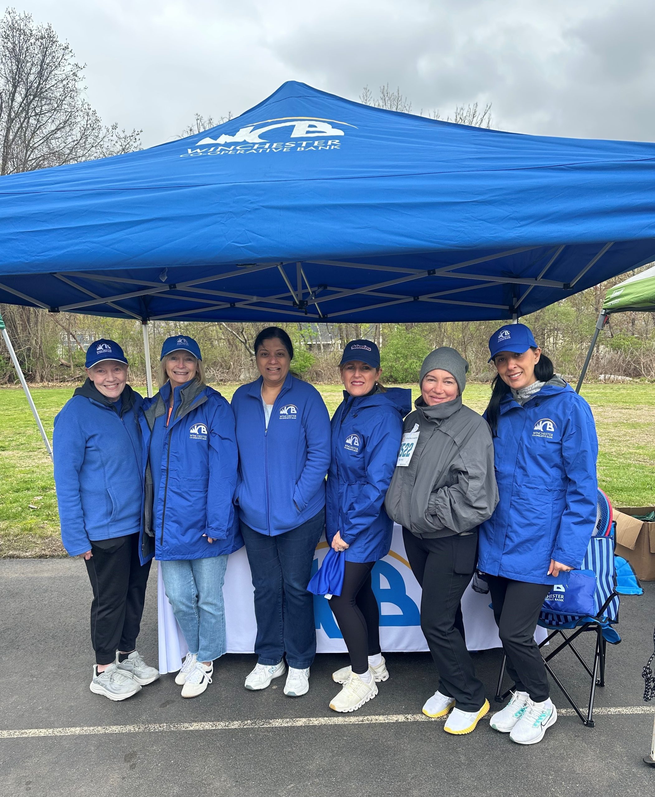 group of women in blue WCB outerwear