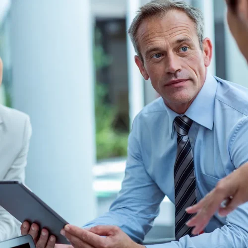 Business man speaking with colleague.